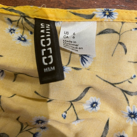 This is a romper from H&M. It is a size 6 and has spaghetti straps. - Picture 3 of 3